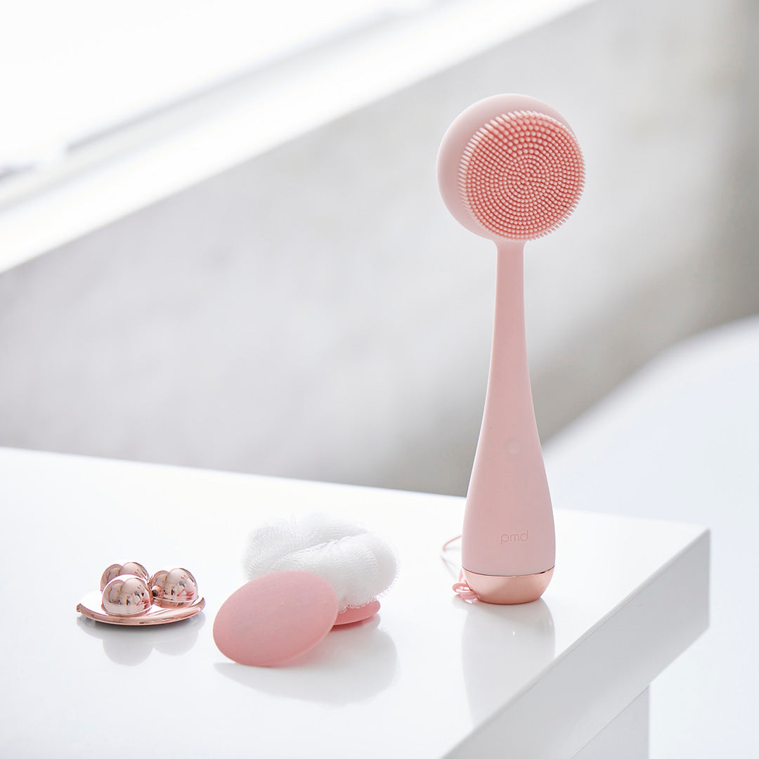 4003-Blush?PMD Clean Body in blush on countertop with all attachments