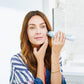 1005-Sky?Personal Microderm Elite in Sky being used by woman on cheek 