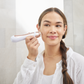 1005-RGold?Personal Microderm Elite Pro in Rose Gold being used by woman